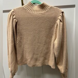 Beige colored mock neck sweater. Puffy sleeves size medium.